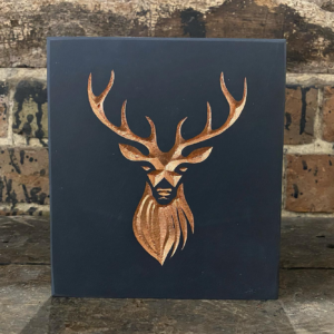 Gold deer on slate