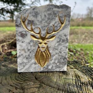 Gold deer on reclined marble